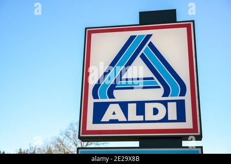 Ratzeburg, Germany, January 12, 2021:  Commercial logo sign of Aldi north against a blue sky, the large discount supermarket chain of the Albrecht bro Stock Photo