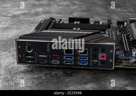 Varna, Bulgaria, January 11, 2021. Back panel ports of MSI mag Z490 Tomahawk gaming motherboard on a dark background. Modern desktop computer hardware Stock Photo