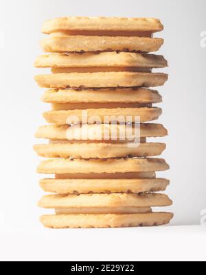 Close up of a custard cream biscuit on a white background. Stock Photo
