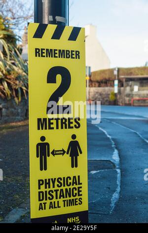 A sign in the high street of Aberdour reminding people to social distance Stock Photo