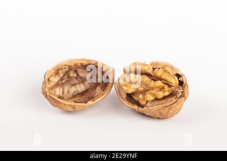 A walnut split in two showing the seed inside. Stock Photo