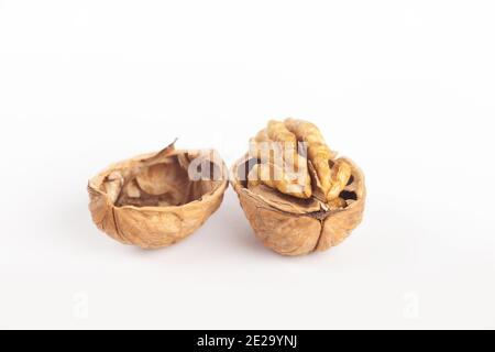 A walnut split in two showing the seed inside. Stock Photo