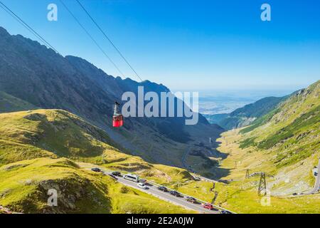 Red cable car above the Transfagarasan Alpine Road Stock Photo