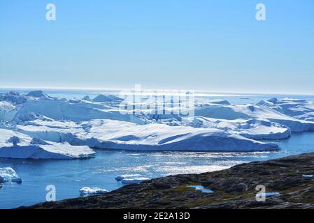 beautiful massive icebergs with blue sea in the Disko bay Greenland - Icefjord Ilulissat - Baffin bay Stock Photo