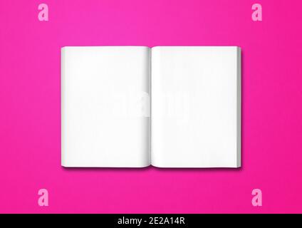 Open book isolated on a pink background Stock Photo