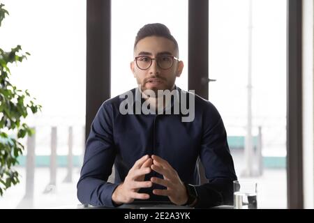 Arabic businessman talk on video call in office Stock Photo