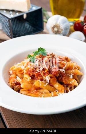 dish of delicious penne pasta with bolognese sauce, ITalian Cuisine Stock Photo