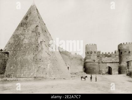Vintage 19th century photograph: The Pyramid of Cestius is an ancient pyramid in Rome, Italy, near the Porta San Paolo and the Protestant Cemetery. It was built as a tomb for Gaius Cestius, a member of the Epulones religious corporation. Image c.1890's Stock Photo