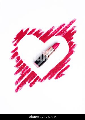 Valentine's Day background. Red and pink lipstick smeared in the shape of heart. Isolated on white background. Cosmetic products Stock Photo