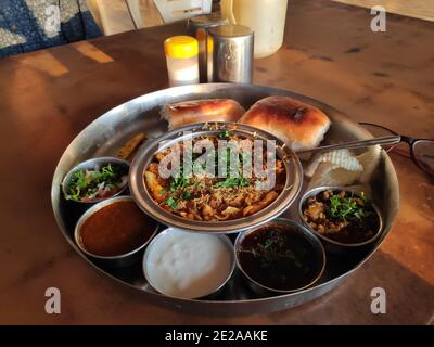 Snack misal pav served with pav bhaji Indian dish for morning breakfast in a restaurant on a highway Stock Photo