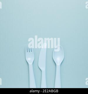 Fork knife spoon on sky blue background. flat lay, top view, copy space Stock Photo