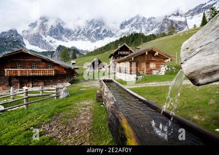 Scenic mountain village with old cabins in the Austrian Alps, Neustattalm, Ramsau am Dachstein, Styria region, Austria