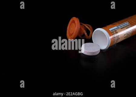 Selective focus on multivitamins effervescent tablets isolated on black. Bucharest, Romania, 2021 Stock Photo