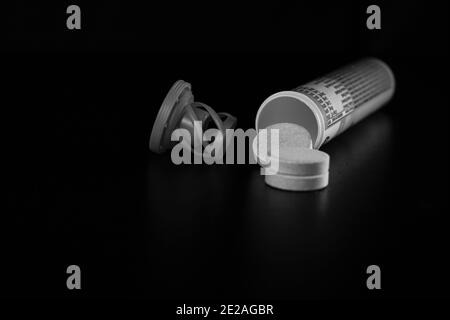 Selective focus on multivitamins effervescent tablets isolated on black. Bucharest, Romania, 2021 Stock Photo