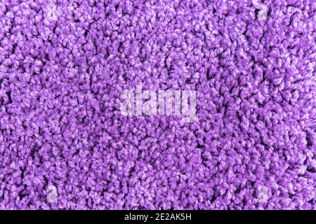 color purple fuchsia texture fluffy carpet synthetic material background Stock Photo