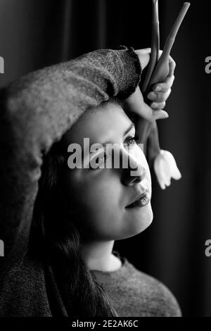 beauty teenager with tulips in hand II Stock Photo
