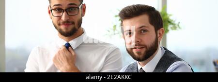 Two cheerful managers working in office with touchpad Stock Photo