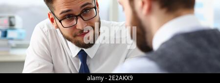 Two managers discussing work matters in office Stock Photo