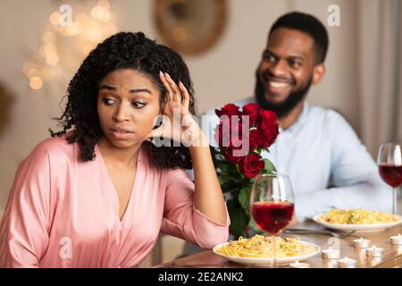 Black Woman On Unsuccessful Date In Restaurant Stock Photo