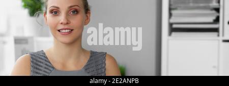 Happy smiling female clerk working with documents Stock Photo