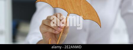 Businesswoman developing company strategy by using wooden figures Stock Photo