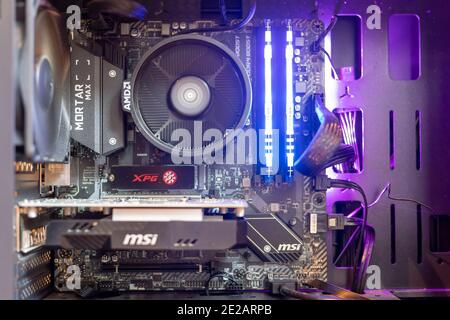 Inside of a Windows pc, showing pc motherboard,RGB RAM,GPU and fans ...