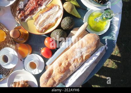 brunch with artichokes mussels croissants fruits brocoli feta salad ham bread and many other food and drink Stock Photo