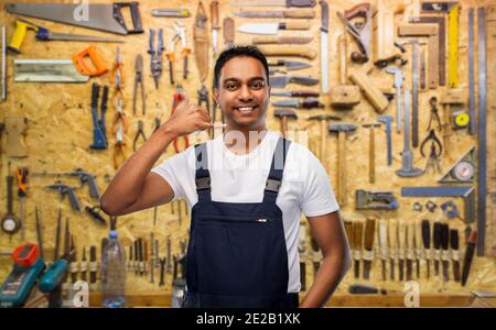 happy worker or builder making phone call gesture Stock Photo