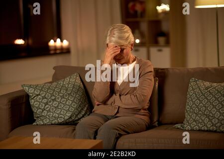 unhappy senior woman suffering from headache Stock Photo