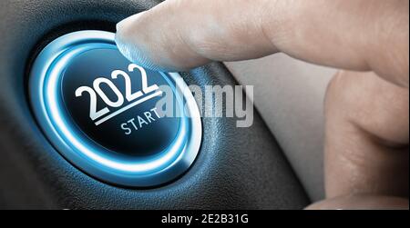 Finger about to press a car ignition button with the text 2022 start. Year two thousand and twenty two concept. Composite image between a hand photogr Stock Photo