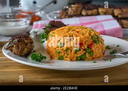 mediterranean djuvec rice with meat skewers and dip Stock Photo