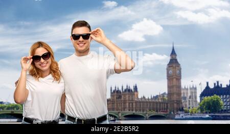 happy couple over big ben tower in city of london Stock Photo