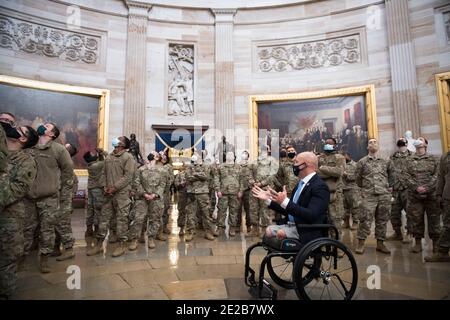 Washington, United States Of America. 13th Jan, 2021. United States Representative Brian Mast (Republican of Florida) introduces members of the National Guard to the Rotunda at the U.S. capitol, as the House of Representatives vote on H. Res. 24, Impeaching Donald John Trump, President of the United States, for high crimes and misdemeanors, at the U.S. Capitol in Washington, DC, Wednesday, January 13, 2021. Credit: Rod Lamkey/CNP | usage worldwide Credit: dpa/Alamy Live News Stock Photo