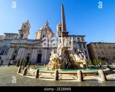 Sant'Agnese in Agone church and Fontana dei Quattro Fiumi in Piazza Navona - Rome, Italy Stock Photo