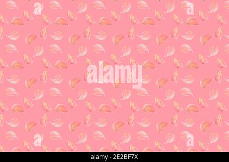 garlic cloves pattern on pastel pink color background. Minimal flat lay food texture Stock Photo