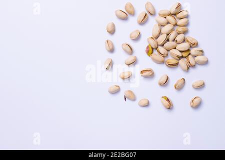 Pistachios on ultimate gray kitchen table. A healthy and nutritious snack. Stock Photo