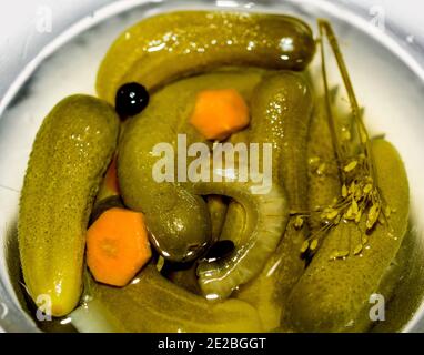 Pickled cucumbers. Salted marinated cucumbers in the glass bowl Stock Photo