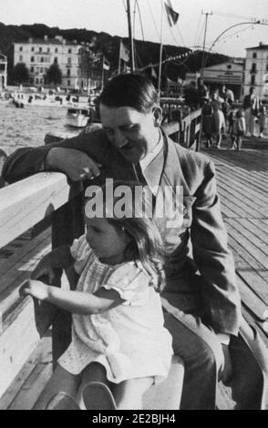 Hitler at rest, seen with Helga Susanne Goebbels (daughter of Joseph and Magda Goebbels.) Stock Photo