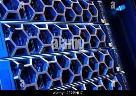 Illuminated Blue Server Hardware In Modern Datacenter Stock Photo