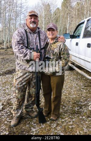 Brother and sister posing together on a wild turkey hunt. Stock Photo
