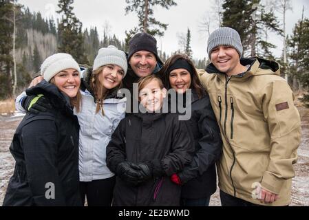 Family togetherness on a winter outing.  A simple, and informal portrait while enjoying a winter excursion. Stock Photo