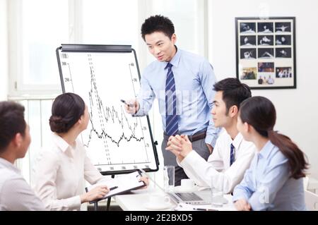 Man giving presentation to co-workers high quality photo Stock Photo