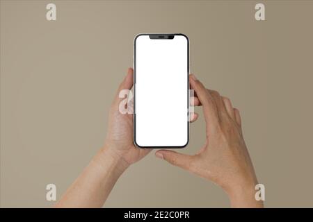 Mockup image of Hand Women holding blank white screen mobile phone. isolated on white background Stock Photo