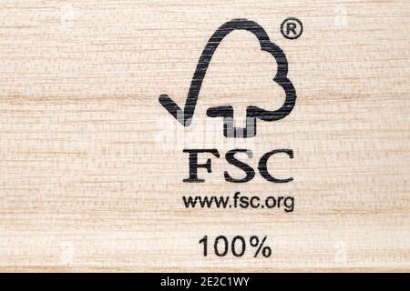 FSC Certified Stamp on soft wood grain. The Forest Stewardship Council (FSC) logo is stamped on wood that complies with environmental standards. Stock Photo