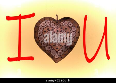 heart in inarsiated wood to form the inscription I Love You Stock Photo