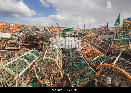 Stacks of fishing net and crab traps at Whitby Marina on the North Yorkshire coast. Stock Photo