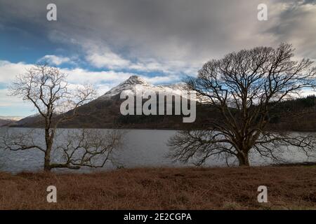 The Pap of Glencoe (Sgorr na Ciche) with a covering of snow, viewed from the north side of Loch Leven, Lochaber, Scotland. Stock Photo