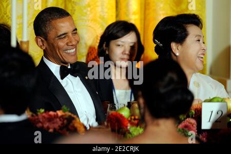 U.S. President Barack Obama and Lee's wife Kim Yoon-ok laugh as South Korean President Lee Myung-bak makes a toast during a State Dinner in the East Room of the White House in Washington, DC, USA on October 13, 2011. The State Visit comes only a day after congress passed a free trade agreement with South Korea. Photo by Roger L. Wollenberg/Pool/ABACAPRESS.COM Stock Photo