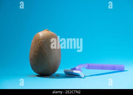 Kiwi Fruit And Razor On Pink Background Hair Removal Concept