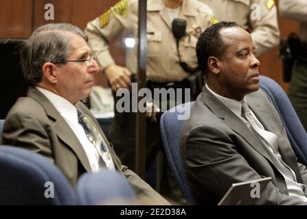 In this photo taken on Oct. 20, 2011, defense expert Dr. Paul White, left, sits next to Dr. Conrad Murray during Murray's involuntary manslaughter trial in Los Angeles, CA, USA, on October 21, 2011. Judge Michael Pastor set a Nov. 16 hearing to determine whether he should find Dr. White, a key defense expert, in contempt for talking to a reporter on Thursday in violation of a gag order. Photo by Reed Saxon/Pool/ABACAPRESS.COM Stock Photo